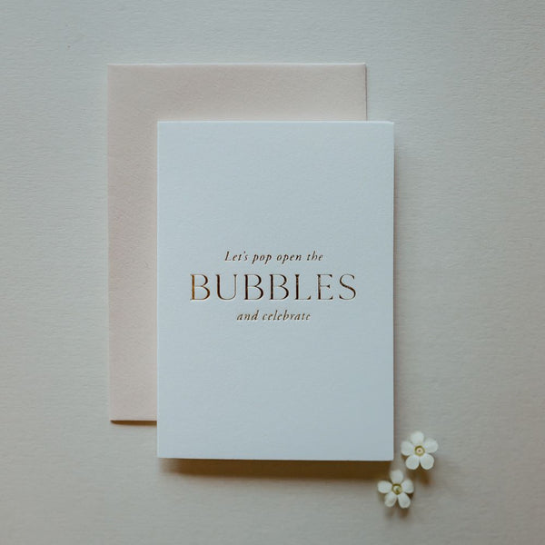 "Let's pop open the bubbles and celebrate" Card