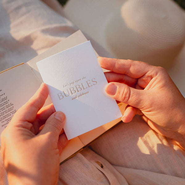 "Let's pop open the bubbles and celebrate" Card
